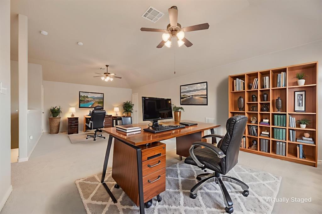 1522 Farm Dale Allen, TX 75002 - Photo 7 of 40 a view of a workspace with furniture and a bookshelf