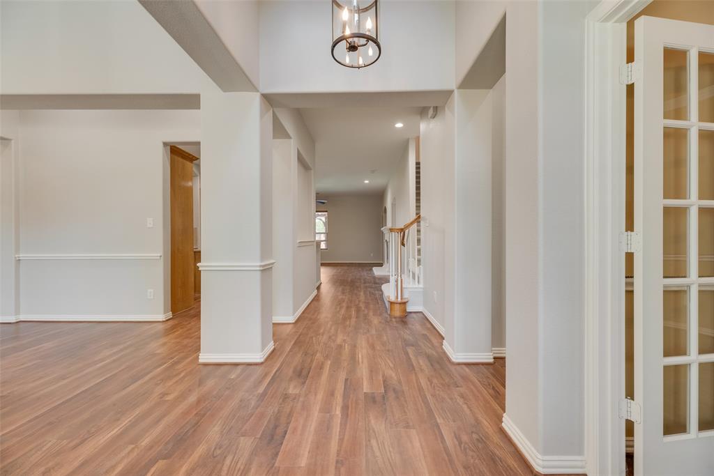 1522 Farm Dale Allen, TX 75002 - Photo 9 of 40 a view of a hallway with wooden floor