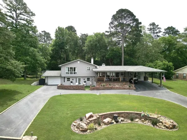 a front view of a house with a yard table and chairs