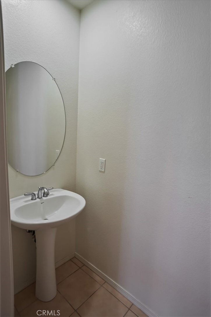20046 Christopher Lane Saugus, CA 91350 - Photo 11 of 25 a bathroom with a sink toilet and mirror