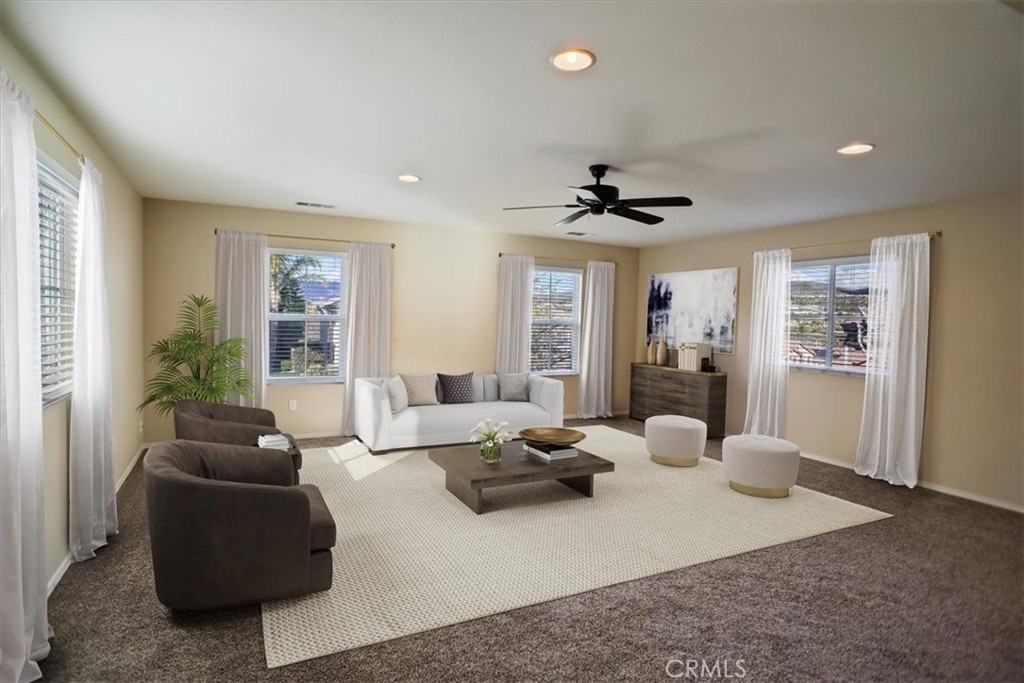 20046 Christopher Lane Saugus, CA 91350 - Photo 12 of 25 a living room with furniture ceiling fan and a window