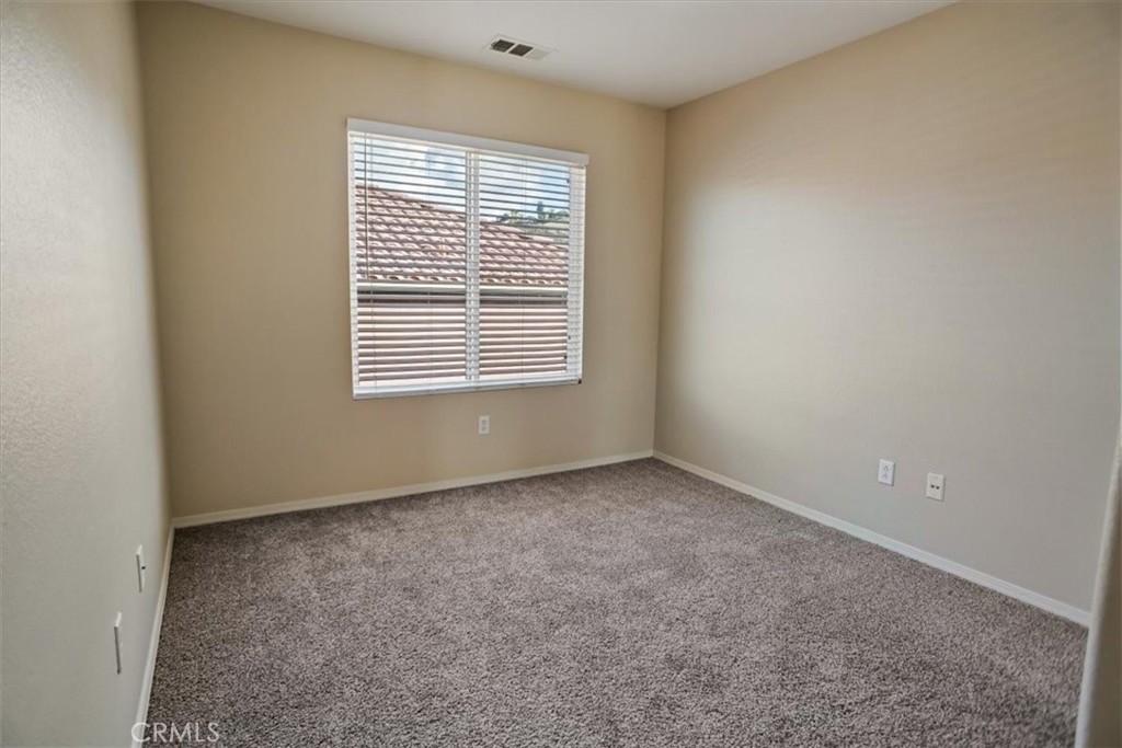 20046 Christopher Lane Saugus, CA 91350 - Photo 20 of 25 a view of an empty room with a window