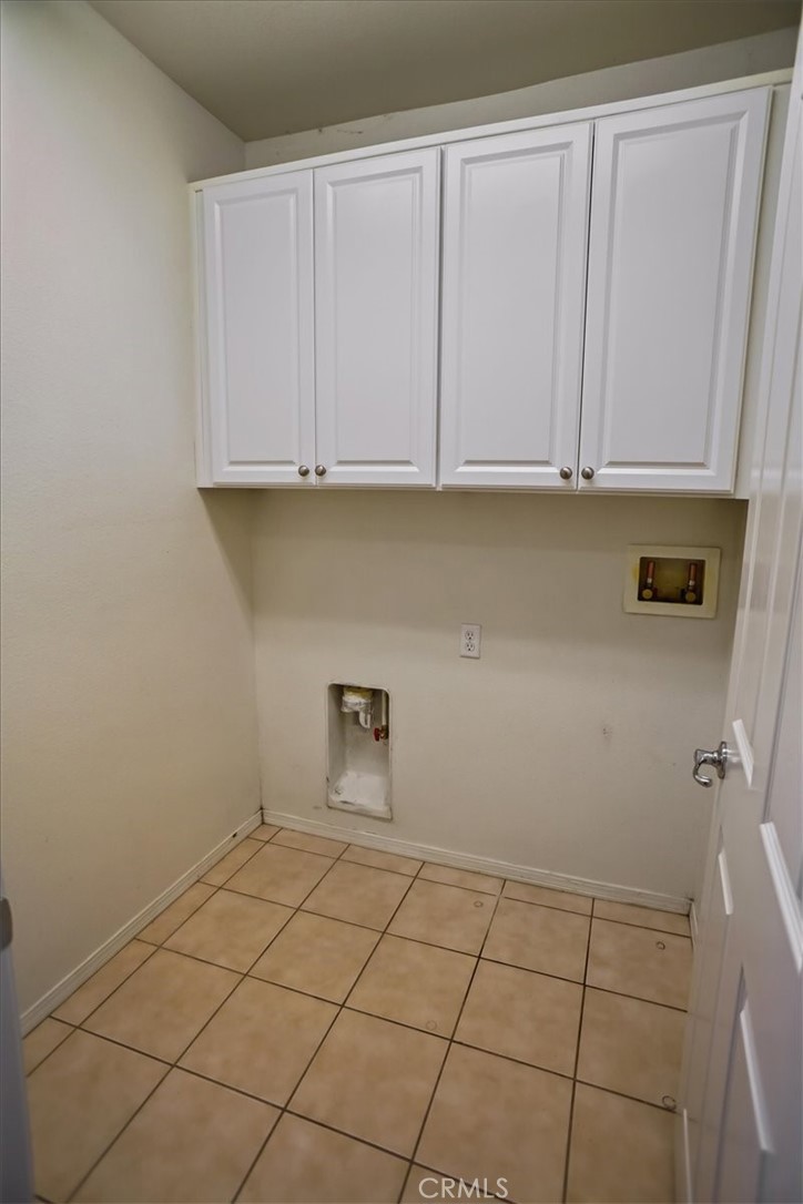 20046 Christopher Lane Saugus, CA 91350 - Photo 22 of 25 a view of kitchen with white cabinets