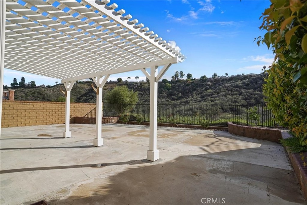 20046 Christopher Lane Saugus, CA 91350 - Photo 23 of 25 a patio with table and chairs