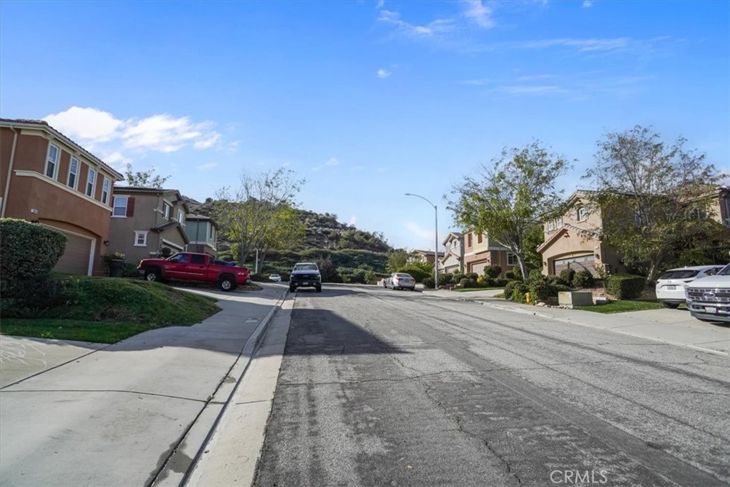 20046 Christopher Lane Saugus, CA 91350 - Photo 24 of 25 a view of a street with a building in the background