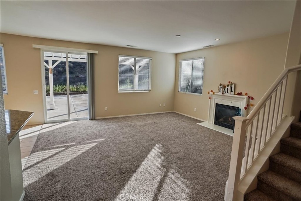 20046 Christopher Lane Saugus, CA 91350 - Photo 5 of 25 a view of a livingroom with an empty space and a window