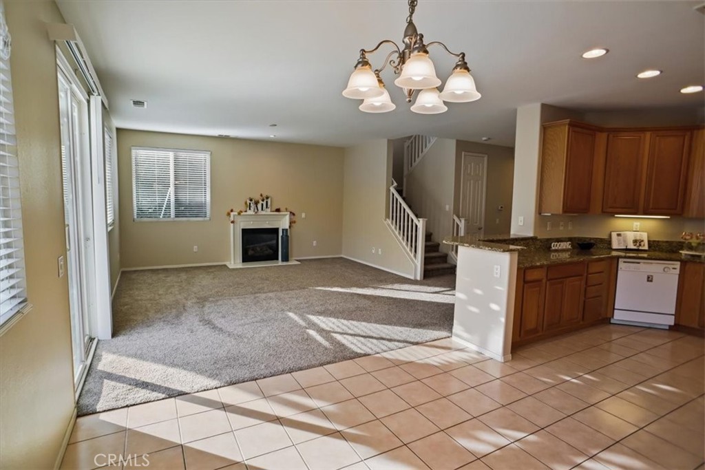 20046 Christopher Lane Saugus, CA 91350 - Photo 8 of 25 a kitchen with stainless steel appliances granite countertop a stove and a refrigerator