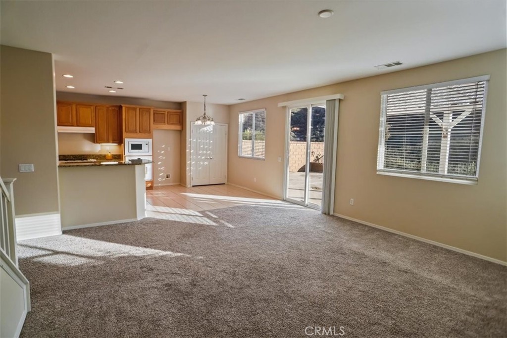 20046 Christopher Lane Saugus, CA 91350 - Photo 9 of 25 a view of a kitchen with kitchen island wooden floor and stainless steel appliances
