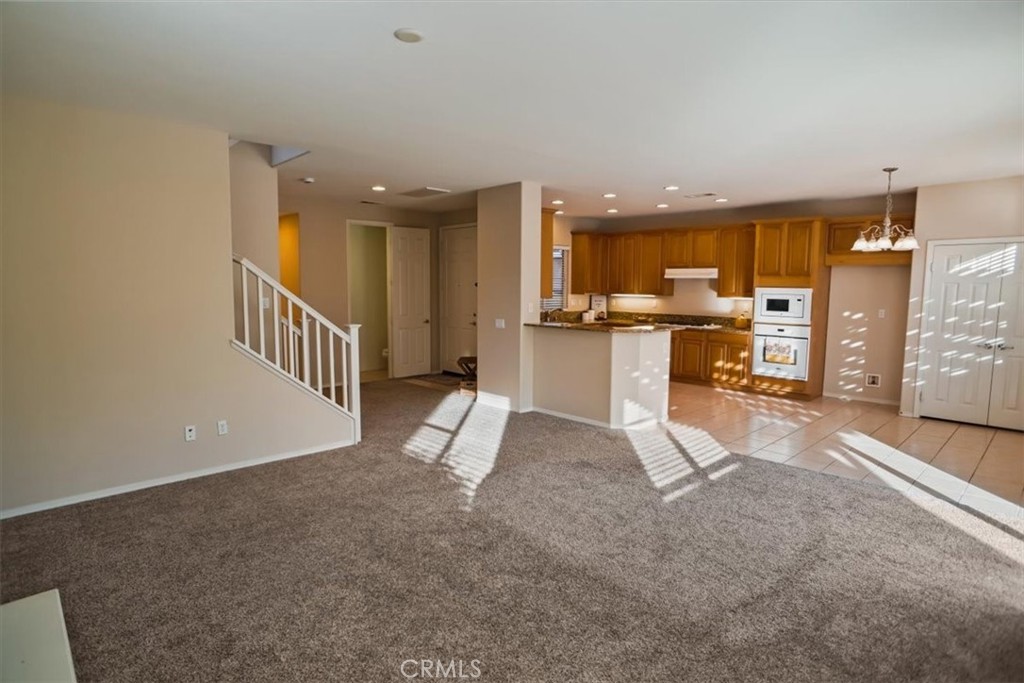 20046 Christopher Lane Saugus, CA 91350 - Photo 10 of 25 a view of a living room and kitchen