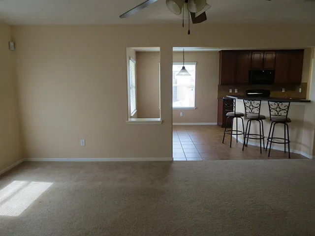 a view of livingroom with furniture and flat screen tv