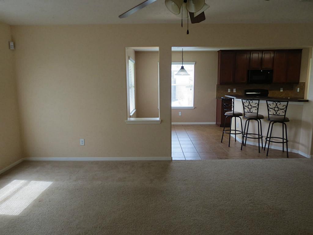 22303 Bridgestone Ridge Drive Spring, TX 77389 - Photo 12 of 25 a view of livingroom with furniture and flat screen tv
