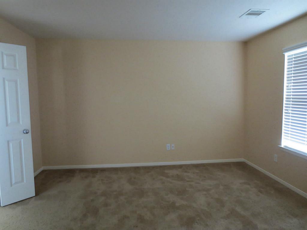 22303 Bridgestone Ridge Drive Spring, TX 77389 - Photo 13 of 25 an empty room with a window