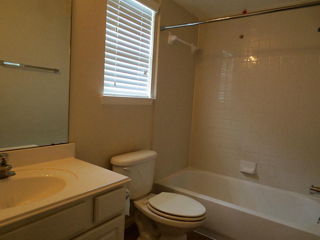 22303 Bridgestone Ridge Drive Spring, TX 77389 - Photo 17 of 25 a bath room with a toilet and a bath tub