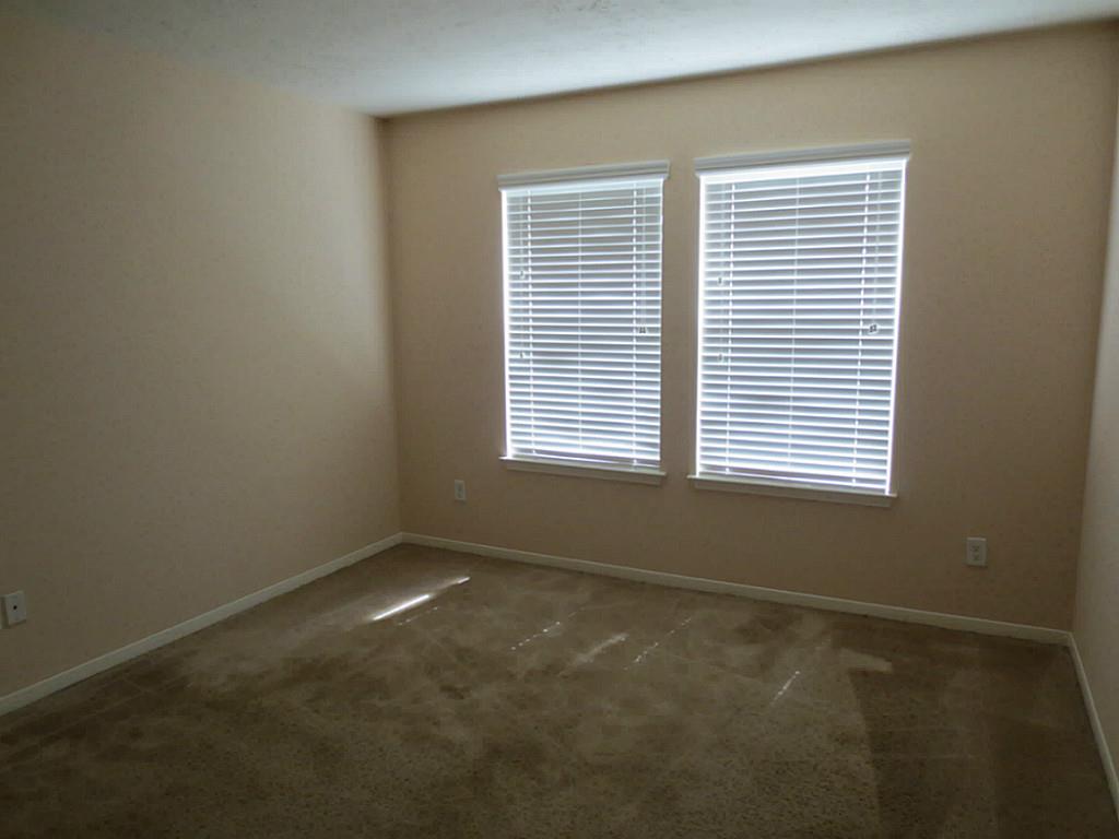 22303 Bridgestone Ridge Drive Spring, TX 77389 - Photo 20 of 25 a view of an empty room with a window