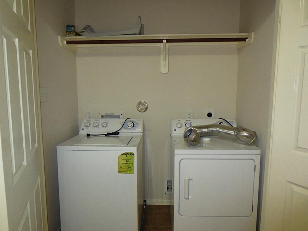 22303 Bridgestone Ridge Drive Spring, TX 77389 - Photo 22 of 25 a utility room with dryer and washer