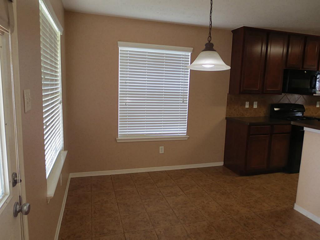 22303 Bridgestone Ridge Drive Spring, TX 77389 - Photo 9 of 25 a view of an empty room with a window