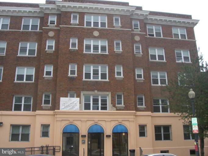 1458 Columbia Road Northwest, Unit 108 Washington, DC 20009 - Photo 1 of 8 a front view of a building with lot of windows
