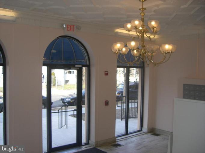 1458 Columbia Road Northwest, Unit 108 Washington, DC 20009 - Photo 2 of 8 a view of a livingroom with a chandelier