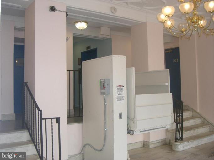 1458 Columbia Road Northwest, Unit 108 Washington, DC 20009 - Photo 3 of 8 a view of a hallway with front door