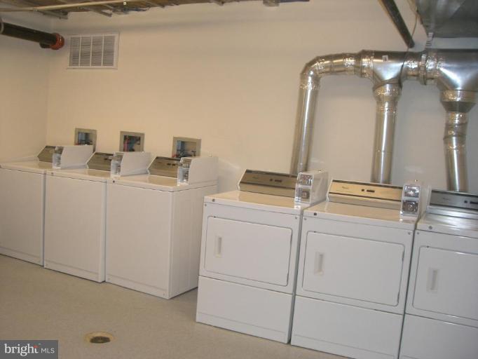 1458 Columbia Road Northwest, Unit 108 Washington, DC 20009 - Photo 6 of 8 a utility room with dryer and washer