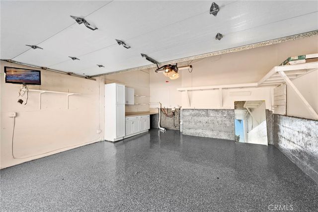 a view of a livingroom with furniture and a window