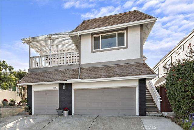 a front view of a house with garage