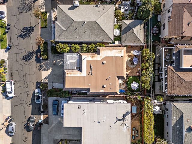an aerial view of residential houses with outdoor space