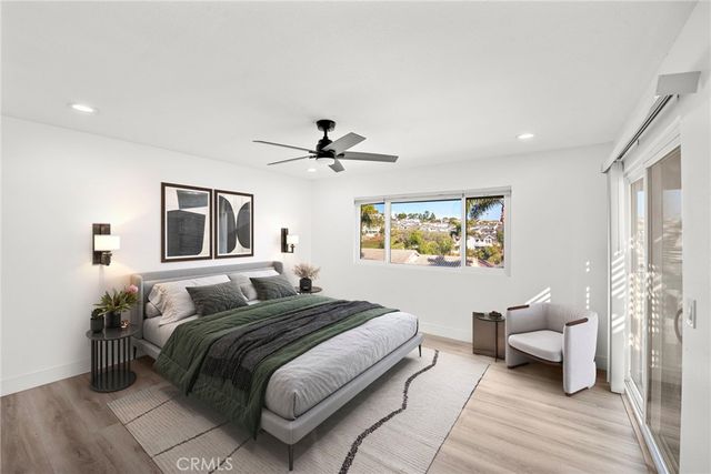 a bedroom with a large bed and a couch