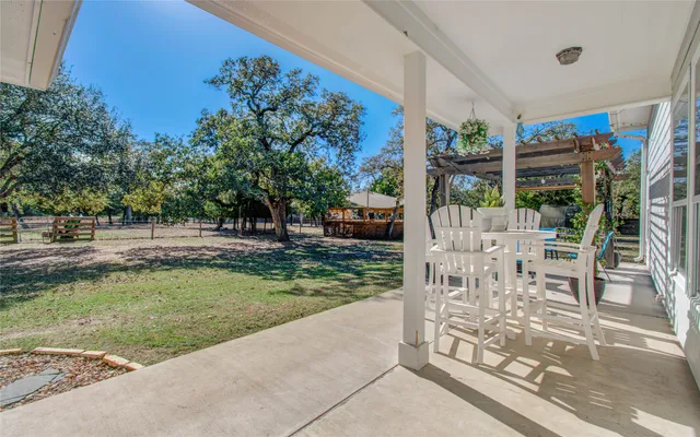 a view of yard with patio