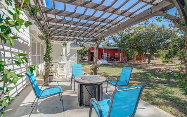 a view of a chairs and table in the patio