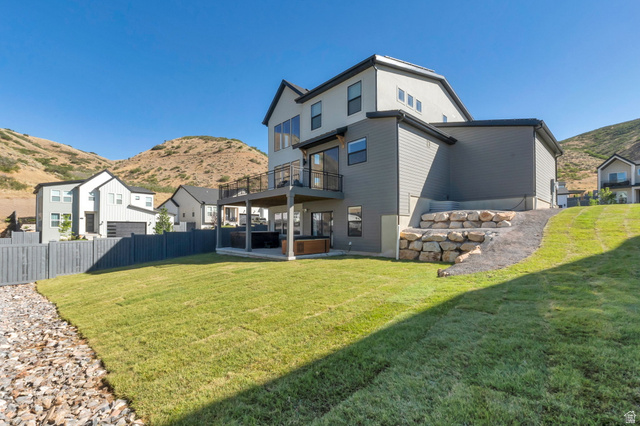 1711 West Canyon Rim Road North Lehi, UT 84048 - Photo 30 of 31 Modern multi-level exterior with a large upper deck and a covered patio below