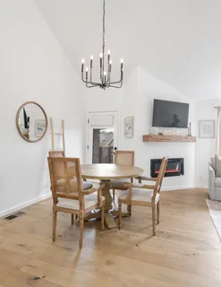 a view of a livingroom with furniture and a fireplace