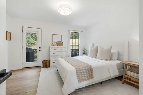 a bedroom with a bed and a cabinets