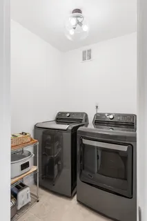 a stove top oven sitting inside of a kitchen