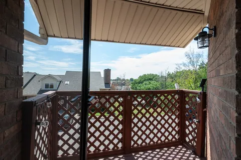 a view of a swimming pool with chairs