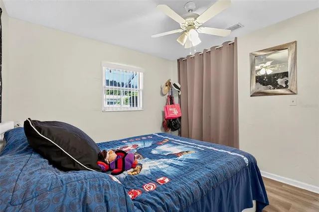an aerial view of a house with a swimming pool outdoor seating and yard