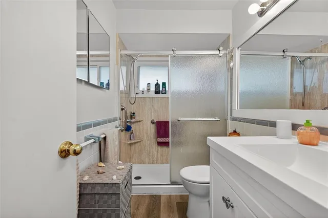 an aerial view of residential houses with city view