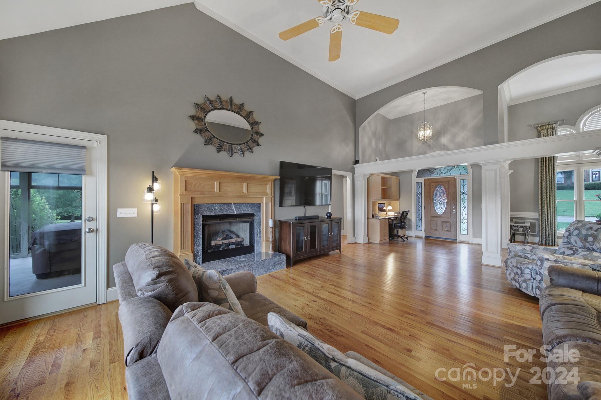 216 Edgewater Way Fort Mill, SC 29708 - Photo 12 of 45 a large living room with furniture a fireplace and pool table