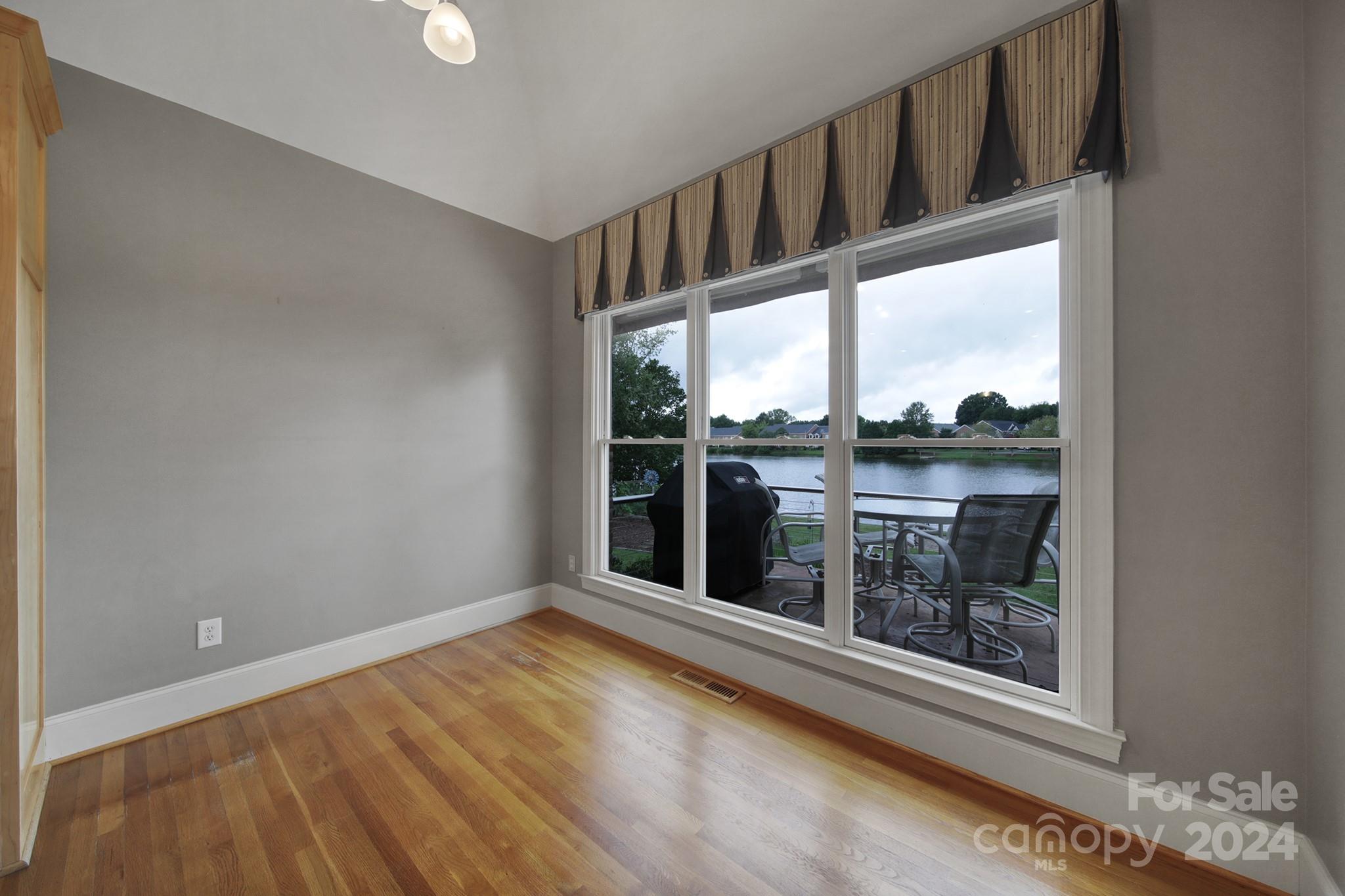 216 Edgewater Way Fort Mill, SC 29708 - Photo 13 of 45 a view of a hallway with wooden floor and a window