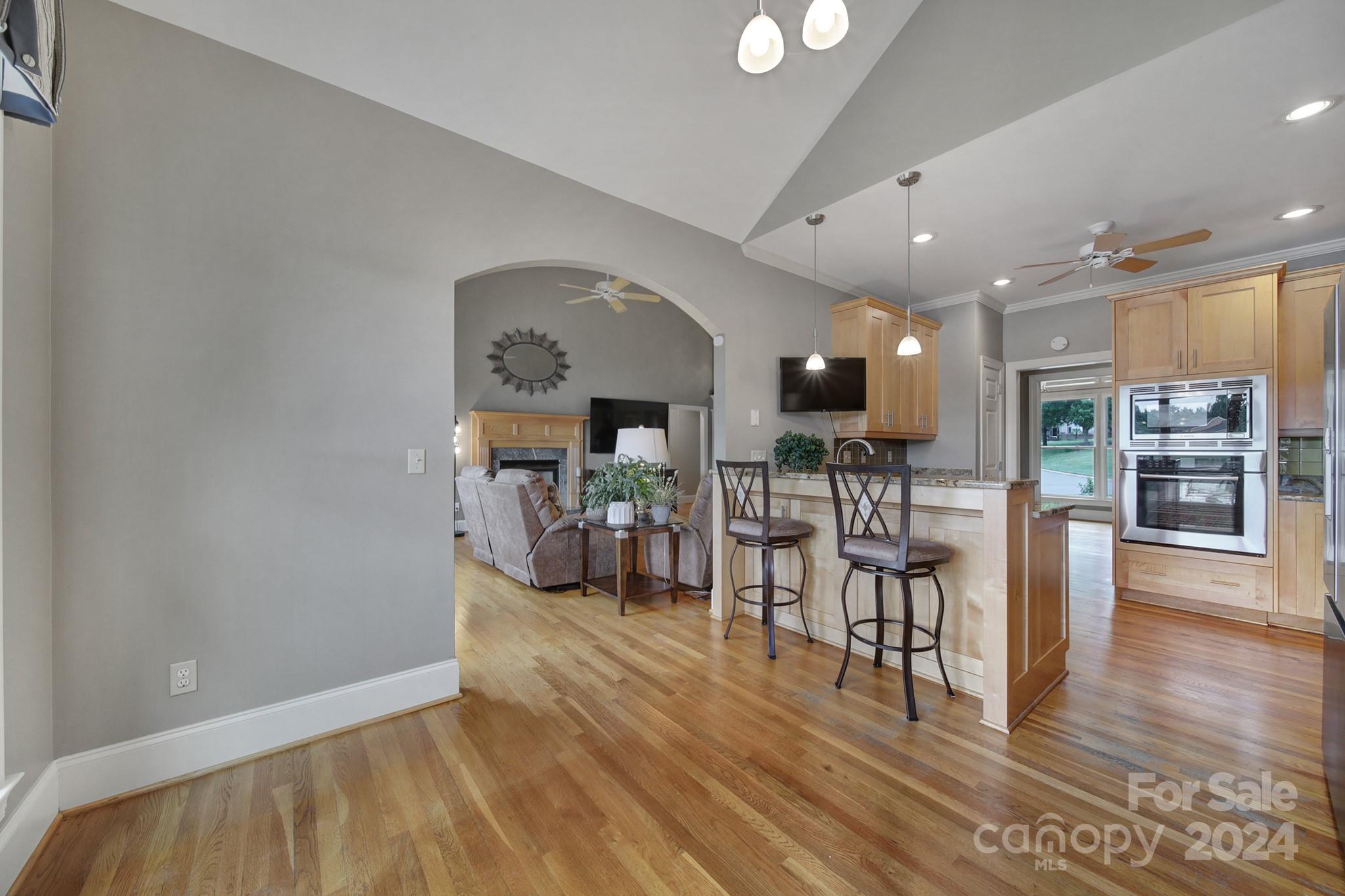 216 Edgewater Way Fort Mill, SC 29708 - Photo 14 of 45 a view of a living room and kitchen with furniture