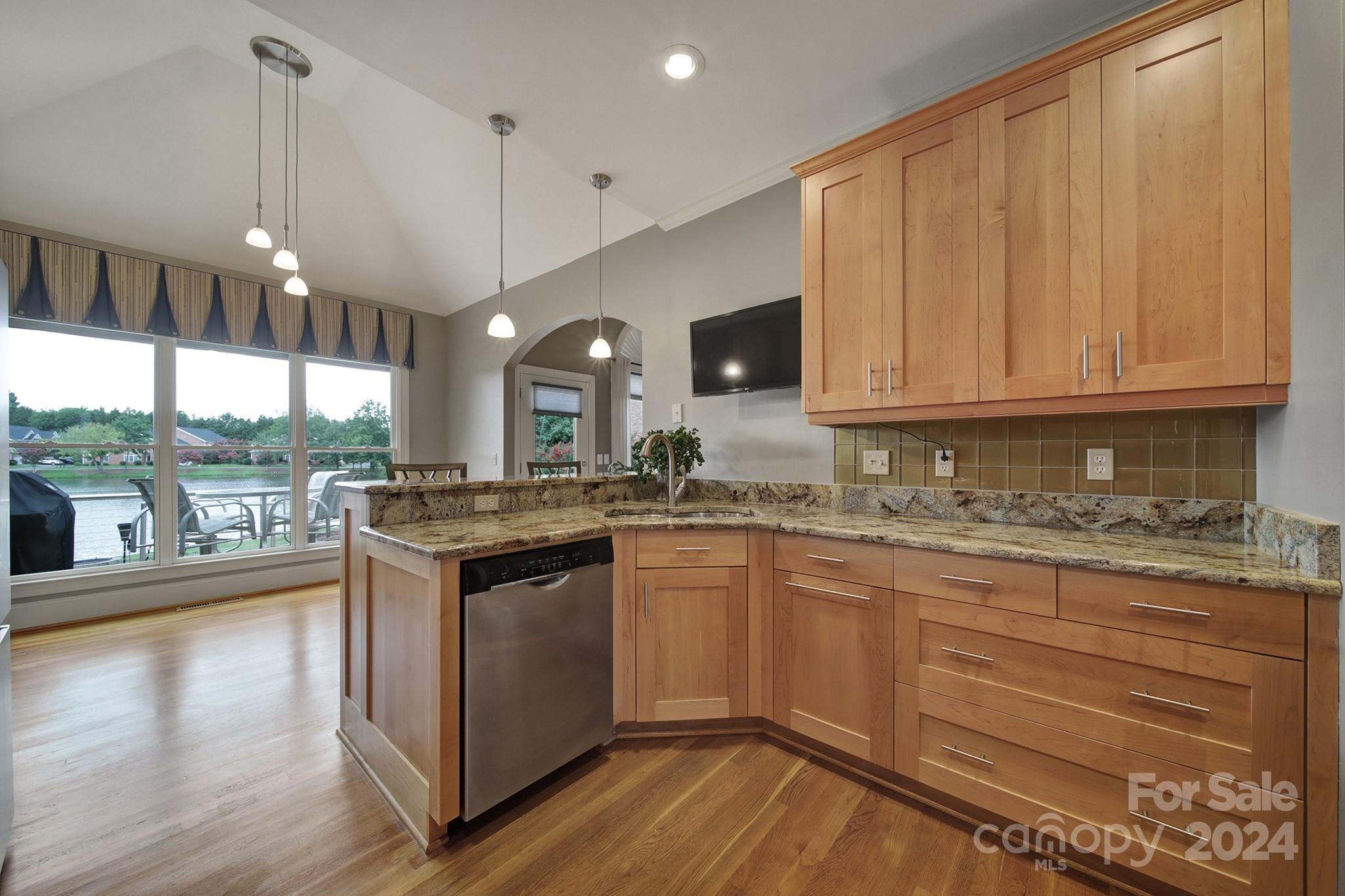 216 Edgewater Way Fort Mill, SC 29708 - Photo 15 of 45 a kitchen with stainless steel appliances granite countertop a stove a sink and a refrigerator