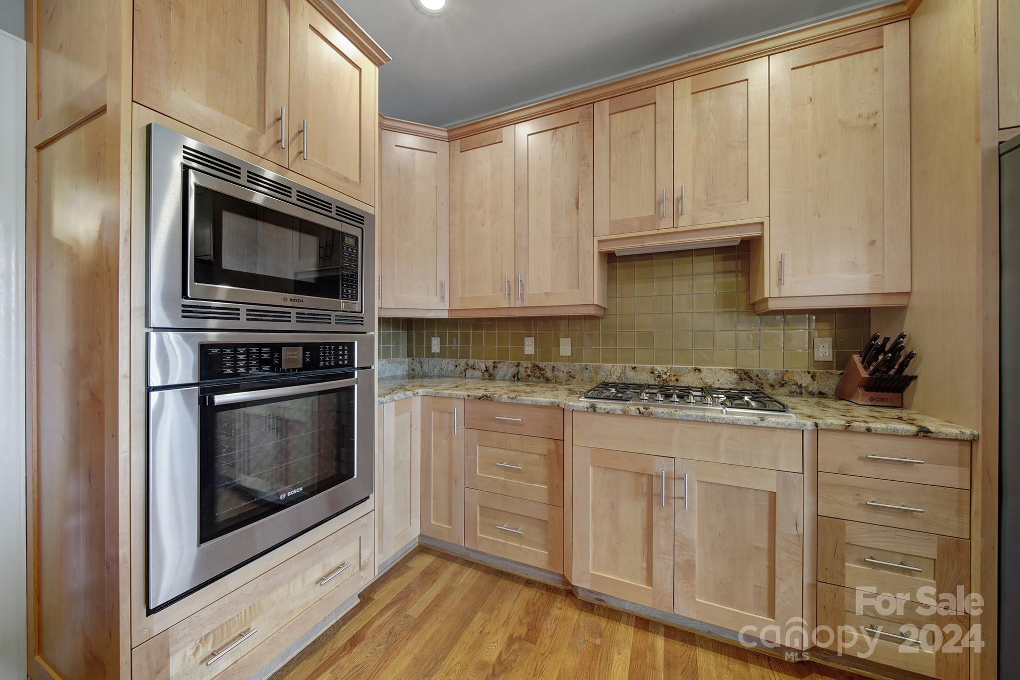 216 Edgewater Way Fort Mill, SC 29708 - Photo 16 of 45 a kitchen with granite countertop white cabinets stainless steel appliances and a counter space