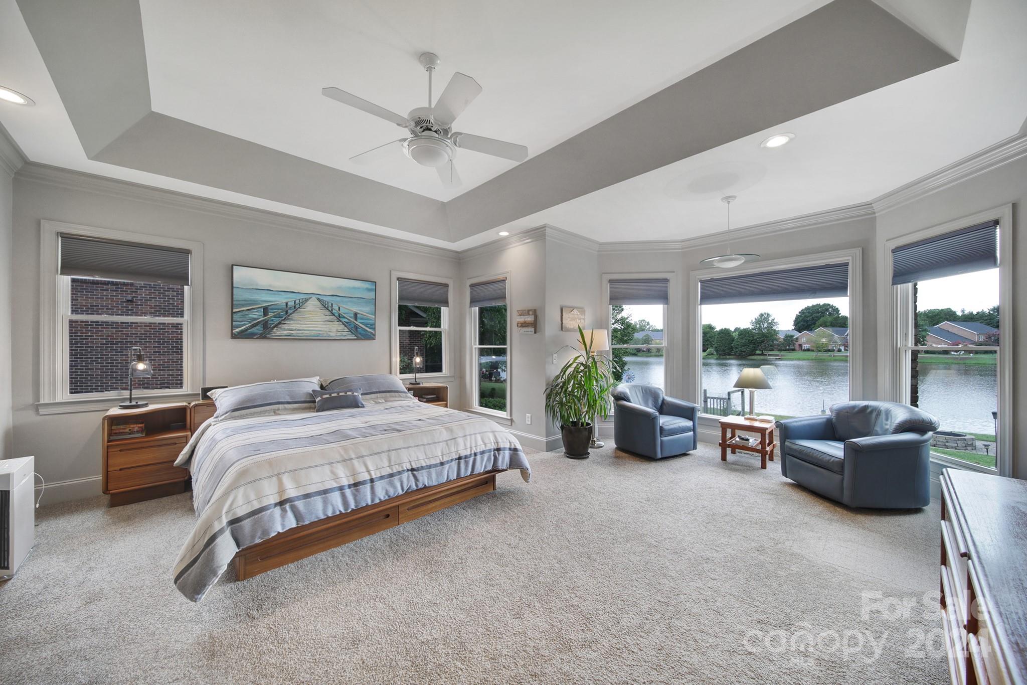 216 Edgewater Way Fort Mill, SC 29708 - Photo 18 of 45 a bedroom with a large bed and a large window