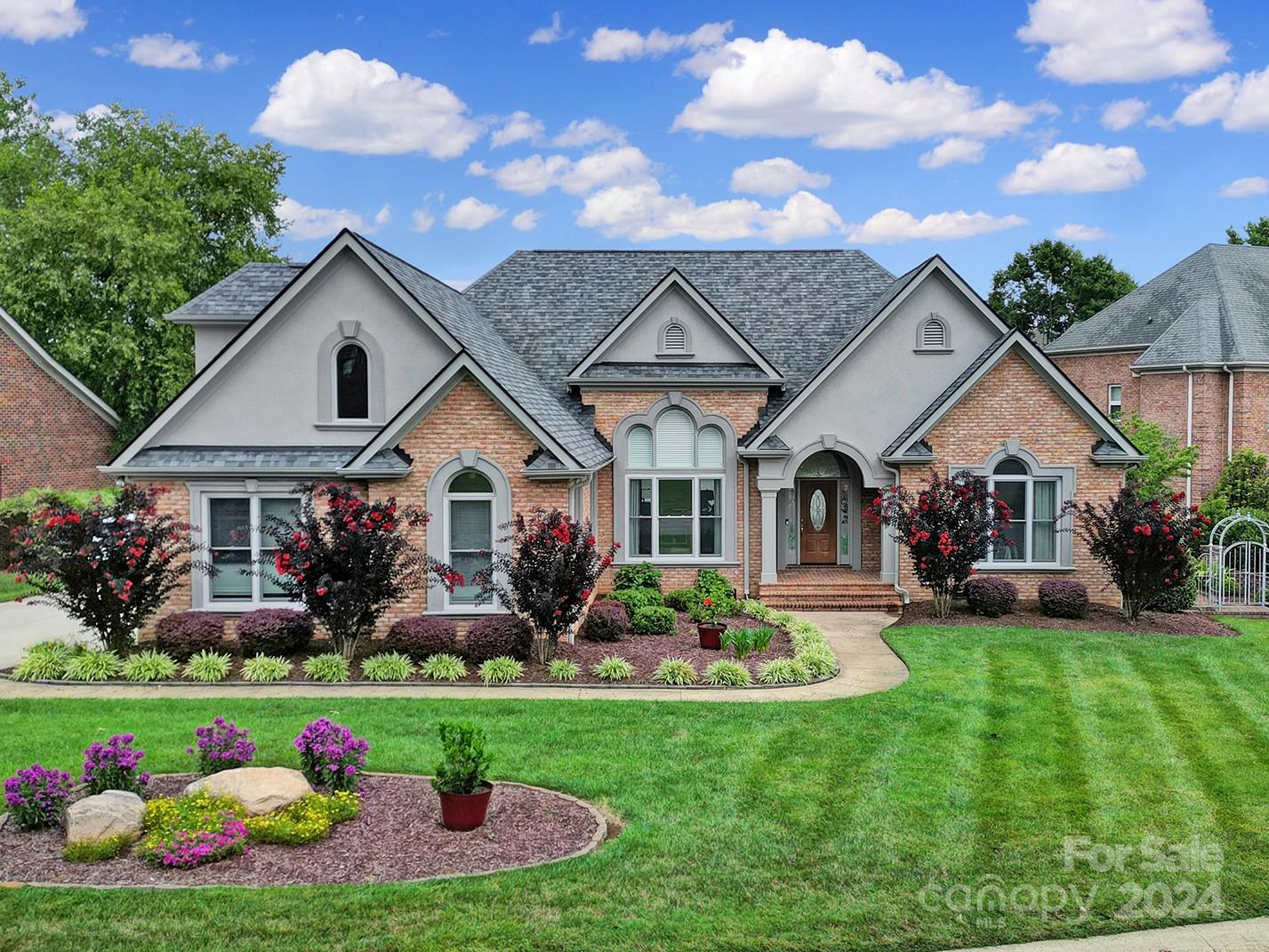 216 Edgewater Way Fort Mill, SC 29708 - Photo 2 of 45 a front view of a house with garden