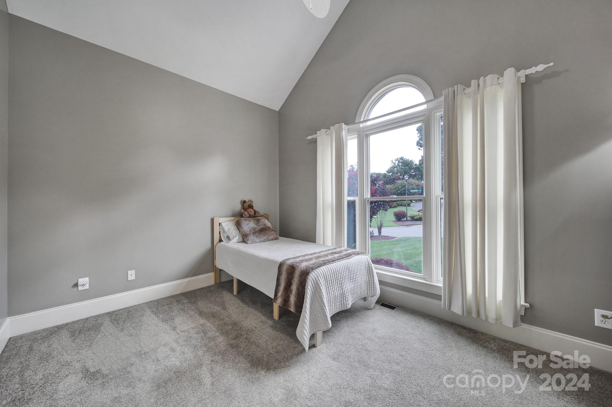 216 Edgewater Way Fort Mill, SC 29708 - Photo 24 of 45 a spacious bedroom with a bed and a large window