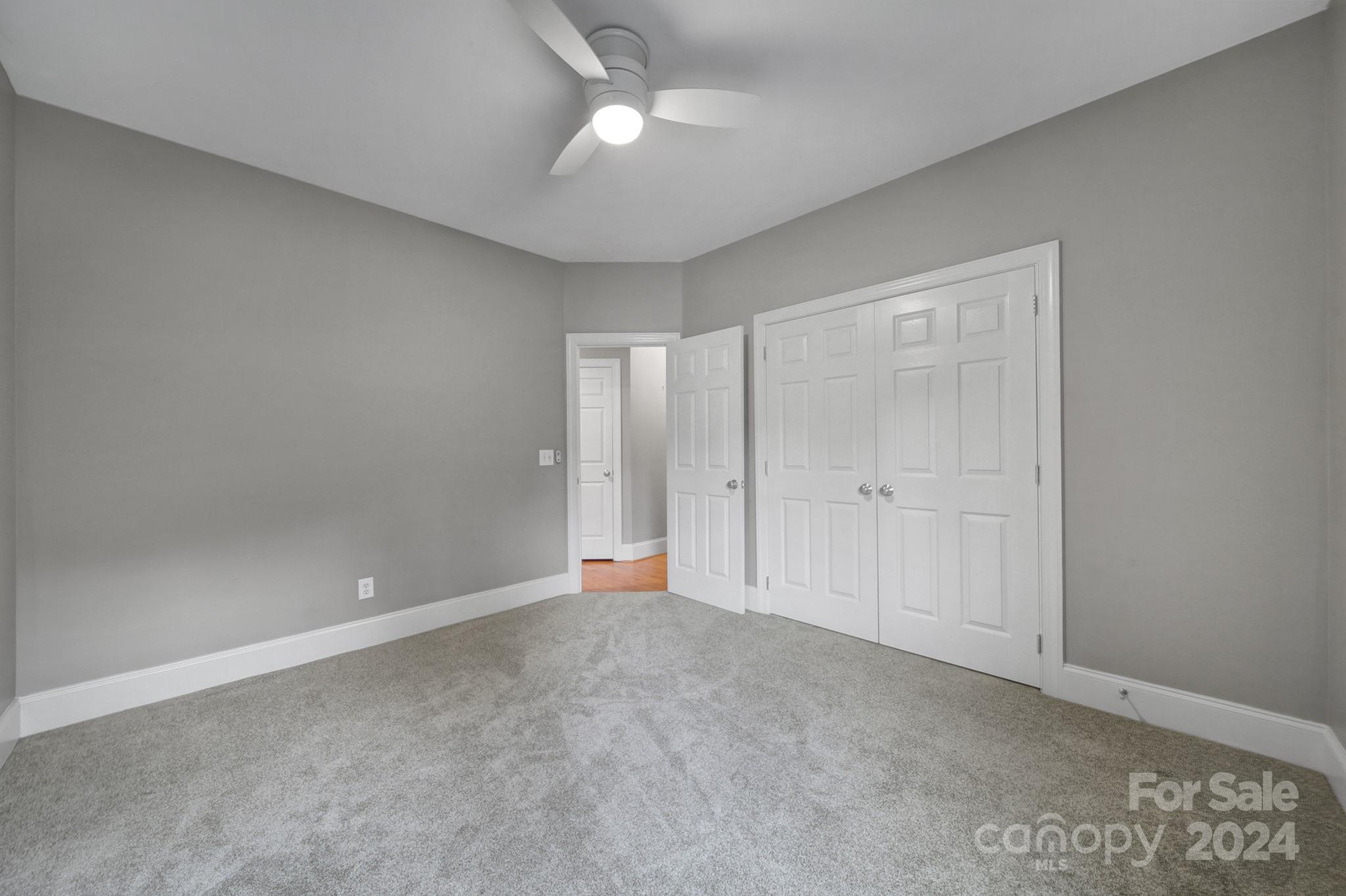 216 Edgewater Way Fort Mill, SC 29708 - Photo 27 of 45 a view of an empty room with a ceiling fan