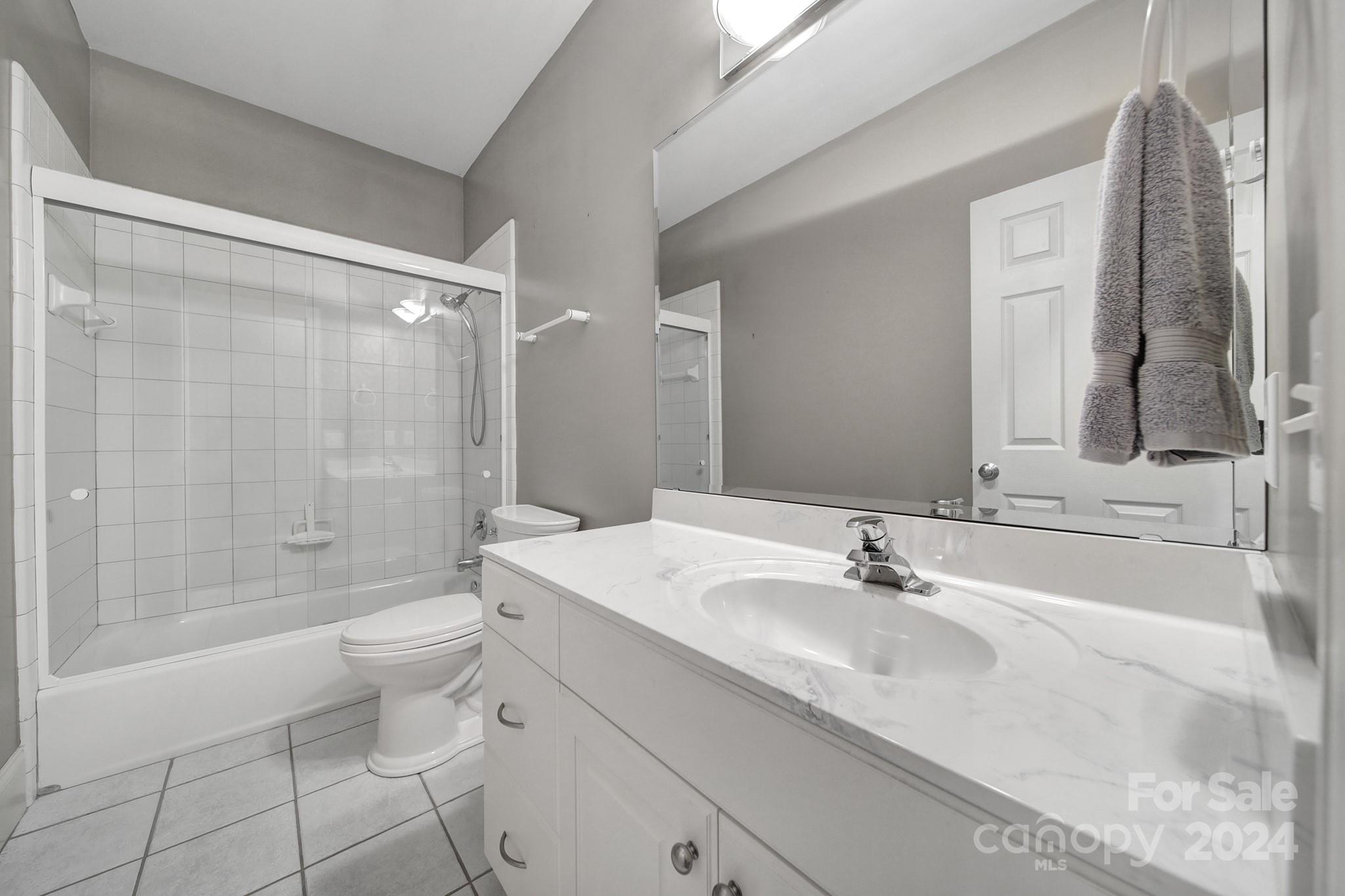 216 Edgewater Way Fort Mill, SC 29708 - Photo 28 of 45 a bathroom with a sink a toilet and shower