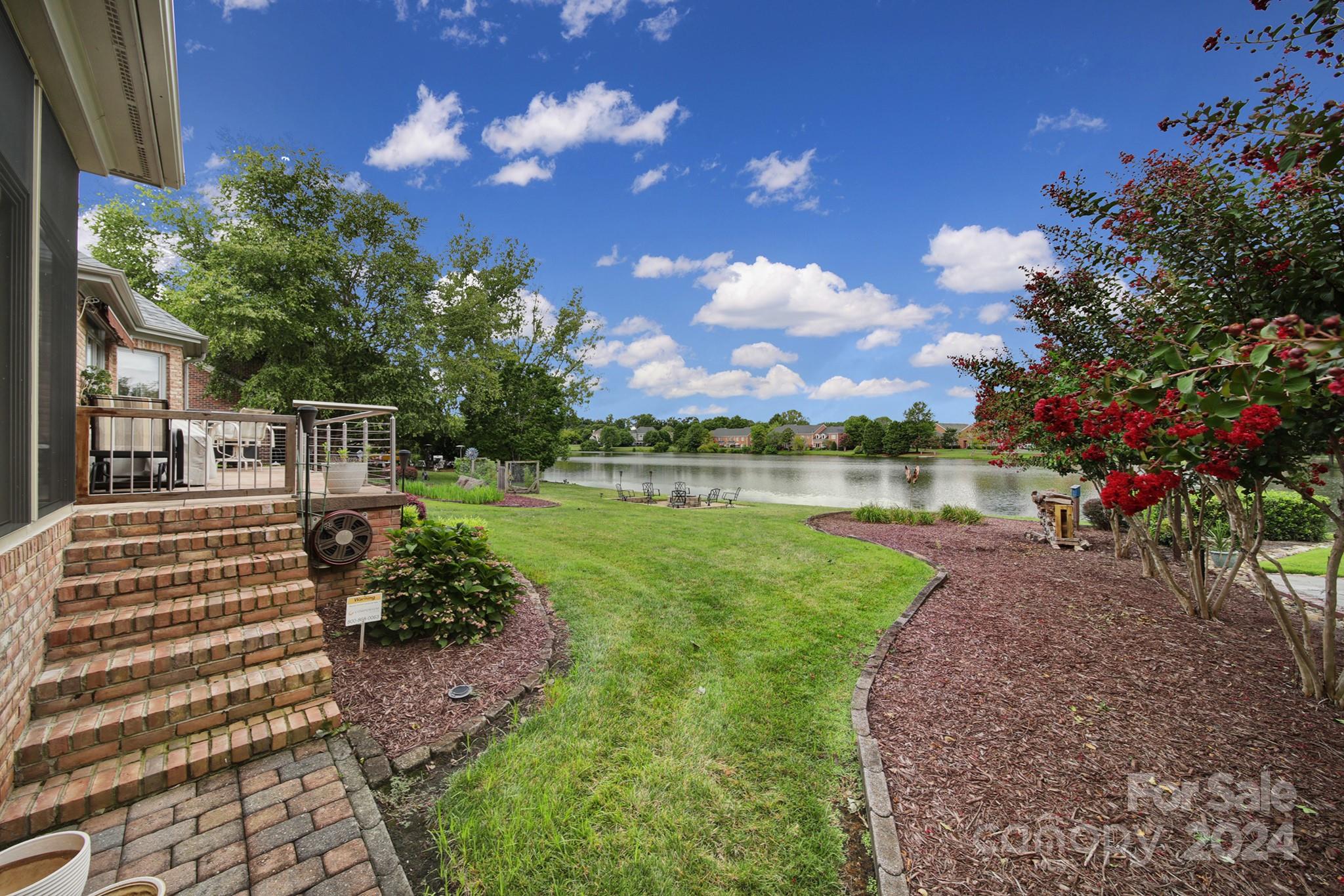 216 Edgewater Way Fort Mill, SC 29708 - Photo 44 of 45 a view of a garden with houses