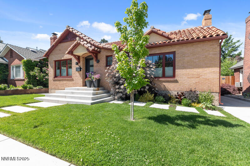 a front view of a house with a yard