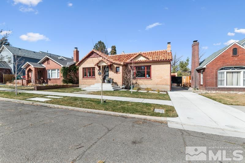 643 John Fremont Drive Reno, NV 89509 - Photo 8 of 42 a front view of a house with a yard